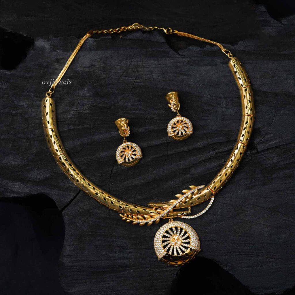Gold chakkra design short necklace With earrings.